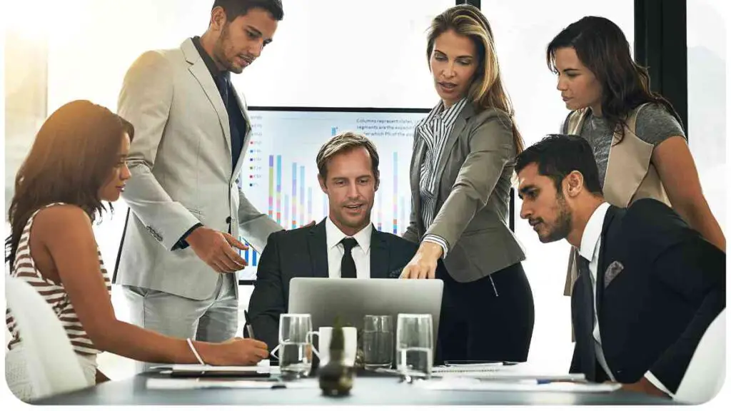 a group of people working together in an office